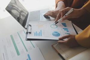 Team of business people working together in the meeting room office, teamwork background charts and graphs banner, double exposure successful teamwork,business planning concept. photo