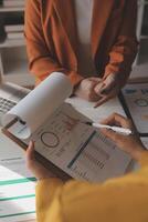 Team of business people working together in the meeting room office, teamwork background charts and graphs banner, double exposure successful teamwork,business planning concept. photo