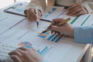 Team of business people working together in the meeting room office, teamwork background charts and graphs banner, double exposure successful teamwork,business planning concept. photo