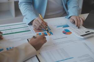 Team of business people working together in the meeting room office, teamwork background charts and graphs banner, double exposure successful teamwork,business planning concept. photo