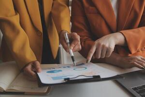 Team of business people working together in the meeting room office, teamwork background charts and graphs banner, double exposure successful teamwork,business planning concept. photo