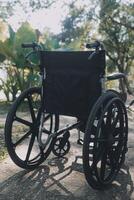 Single wheelchair parked in hospital hallway photo