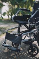 Single wheelchair parked in hospital hallway photo