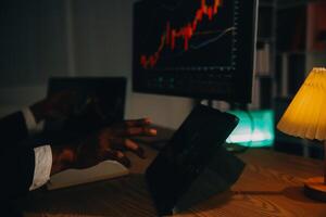 Thoughtful focused successful caucasian male stock investor, broker, financial adviser, sits at work desk, looks at computer, pensively analyze risks and prospects, rise or fall of cryptocurrency coin photo