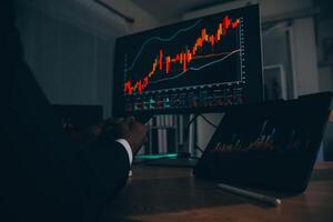 Thoughtful focused successful caucasian male stock investor, broker, financial adviser, sits at work desk, looks at computer, pensively analyze risks and prospects, rise or fall of cryptocurrency coin photo