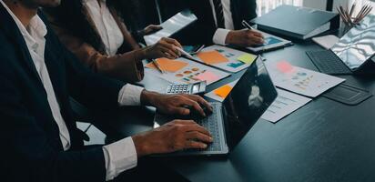 Business team collaboration discussing working analyzing with financial data and marketing growth report graph in team, presentation and brainstorming to strategy planning making profit of company. photo