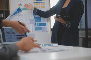 Close up ux developer and ui designer use augmented reality brainstorming about mobile app interface wireframe design on desk at modern office.Creative digital development agency photo