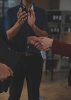 Business handshake for teamwork of business merger and acquisition,successful negotiate,hand shake,two businessman shake hand with partner to celebration partnership and business deal concept photo