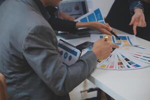 Close up ux developer and ui designer use augmented reality brainstorming about mobile app interface wireframe design on desk at modern office.Creative digital development agency photo