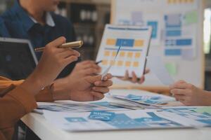 Close up ux developer and ui designer use augmented reality brainstorming about mobile app interface wireframe design on desk at modern office.Creative digital development agency photo