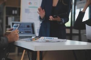Close up ux developer and ui designer use augmented reality brainstorming about mobile app interface wireframe design on desk at modern office.Creative digital development agency photo