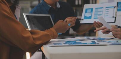 Close up ux developer and ui designer use augmented reality brainstorming about mobile app interface wireframe design on desk at modern office.Creative digital development agency photo