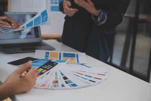 Close up ux developer and ui designer use augmented reality brainstorming about mobile app interface wireframe design on desk at modern office.Creative digital development agency photo