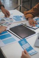 Close up ux developer and ui designer use augmented reality brainstorming about mobile app interface wireframe design on desk at modern office.Creative digital development agency photo