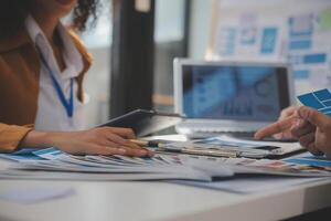 Close up ux developer and ui designer use augmented reality brainstorming about mobile app interface wireframe design on desk at modern office.Creative digital development agency photo