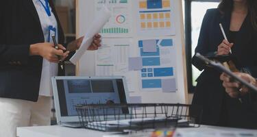 Close up ux developer and ui designer use augmented reality brainstorming about mobile app interface wireframe design on desk at modern office.Creative digital development agency photo