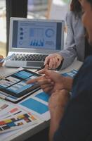 Close up ux developer and ui designer use augmented reality brainstorming about mobile app interface wireframe design on desk at modern office.Creative digital development agency photo