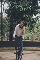 Happy Asian young woman walk and ride bicycle in park, street city her smiling using bike of transportation, ECO friendly, People lifestyle concept. photo