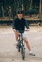 Handsome happy young man with bicycle on a city street, Active lifestyle, people concept photo