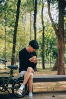 Handsome happy young man with bicycle on a city street, Active lifestyle, people concept photo