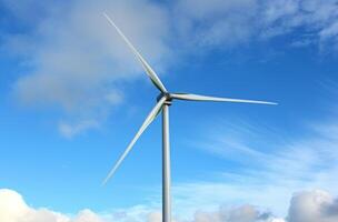 ai generado un blanco viento turbina en contra un azul cielo, renovable energía innovaciones concepto foto