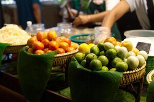 raw papaya ,tomato , lime display for thai salad restaurant with flavoring ingredient photo