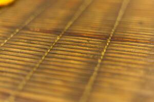 close up dirty old classic bamboo mat pattern background photo