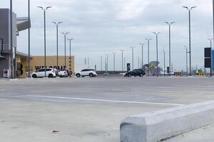 Rooftop parking lot traffic on the street with cloudy sky background photo