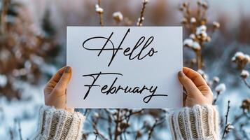 AI generated Hello February card in female hands on background of winter landscape. Hello February card. photo