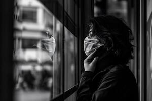 ai generado negro y blanco retrato de un joven mujer mirando fuera el ventana. foto