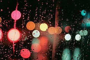 AI generated Raindrops on the window with colorful bokeh. Abstract background. photo