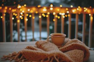 AI generated Cup of coffee wrapped in a warm knitted scarf on a wooden terrace in the evening photo