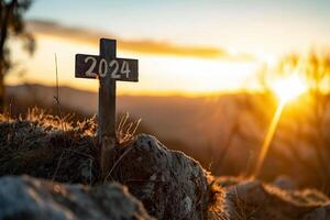 AI generated Wooden cross with the inscription 2024 on the background of the setting sun photo