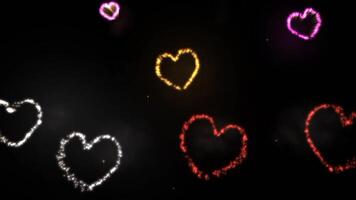 amar, corazón forma vistoso fuegos artificiales celebracion animación efecto en negro fondo, enamorado día romántico antecedentes vídeo video