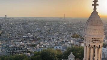 Sunset Over Paris with Eiffel Tower View, The city of Paris bathed in golden sunset light, featuring a detailed foreground of an ornate tower and the Eiffel Tower in the distance. video