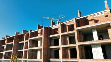 Construction work at the construction site. The house is made of bricks and gas blocks with a floor. A house without windows video