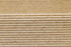 stacks of tongue and groove OSB compressed sawdust sheets photo