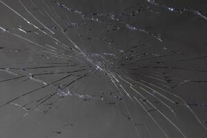 damaged LCD screen with cracks, full-frame background photo