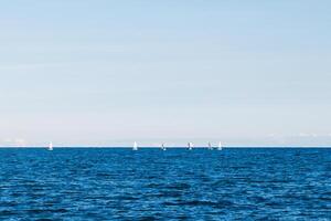 group of sailing boats on lake photo