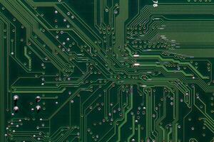 back side of green digital circuit board - flat full-frame background and texture photo