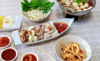 Soft Boiled Mixed Meat with Spicy Dip.  Thicken Boat Noodles Soup photo