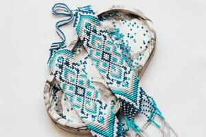 Geometric pattern on the gerdan ornament, Ukrainian beaded ornament, amulet. photo