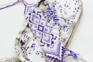 Geometric pattern on the gerdan ornament, Ukrainian beaded ornament, amulet. photo
