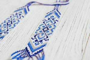 Geometric pattern on the gerdan ornament, Ukrainian beaded ornament, amulet. photo