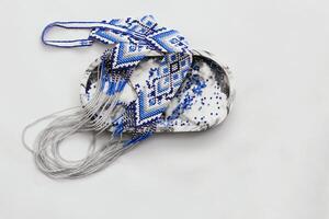 Geometric pattern on the gerdan ornament, Ukrainian beaded ornament, amulet. photo