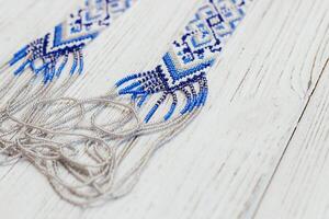 Geometric pattern on the gerdan ornament, Ukrainian beaded ornament, amulet. photo