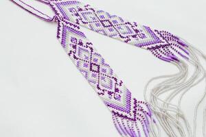 Geometric pattern on the gerdan ornament, Ukrainian beaded ornament, amulet. photo
