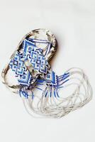 Geometric pattern on the gerdan ornament, Ukrainian beaded ornament, amulet. photo