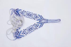 Geometric pattern on the gerdan ornament, Ukrainian beaded ornament, amulet. photo