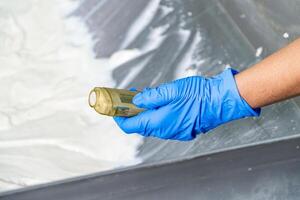 caucasion woman working in a food factory wearing protective clothes and gloves. photo